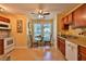 Simple kitchen with white appliances and wood cabinets at 1401 S Palmetto Ave # 402, Daytona Beach, FL 32114