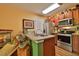 Well-equipped kitchen featuring stainless steel appliances and ample counter space at 1401 S Palmetto Ave # 402, Daytona Beach, FL 32114