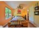 Bright bedroom with bamboo bed frame and a view of the outdoors at 1401 S Palmetto Ave # 402, Daytona Beach, FL 32114