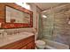 Updated bathroom with a walk-in shower, modern vanity, and tile at 1401 S Palmetto Ave # 402, Daytona Beach, FL 32114