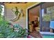 Relaxing patio with tropical plants and outdoor seating at 1401 S Palmetto Ave # 402, Daytona Beach, FL 32114