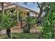 Community clubhouse with lush landscaping and outdoor seating at 1401 S Palmetto Ave # 402, Daytona Beach, FL 32114