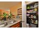 Well-stocked pantry with ample shelving for storage at 1401 S Palmetto Ave # 402, Daytona Beach, FL 32114