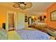 Bedroom with bamboo furniture and access to the bathroom and living areas at 1401 S Palmetto Ave # 402, Daytona Beach, FL 32114