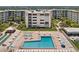 Community pool with surrounding lounge chairs at 4175 S Atlantic Ave # 1130, New Smyrna Beach, FL 32169