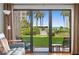 Living room with sliding doors leading to balcony and ocean view at 4175 S Atlantic Ave # 1130, New Smyrna Beach, FL 32169