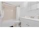 Bathroom with bathtub, toilet, and white vanity at 4175 S Atlantic Ave # 1130, New Smyrna Beach, FL 32169