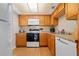 Well-equipped kitchen with ample wood cabinets and modern appliances at 4175 S Atlantic Ave # 1130, New Smyrna Beach, FL 32169
