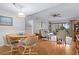 Open living area with hardwood floors, featuring dining and seating areas with access to the patio at 4175 S Atlantic Ave # 1130, New Smyrna Beach, FL 32169