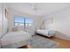 Bedroom with twin beds, nightstands, and a ceiling fan at 4175 S Atlantic Ave # 1130, New Smyrna Beach, FL 32169