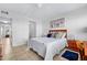 Bright bedroom with double bed and access to hallway at 4175 S Atlantic Ave # 1130, New Smyrna Beach, FL 32169