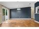 Bright dining room with hardwood floors and sliding glass doors leading to a deck at 1164 Bayview Ln, Port Orange, FL 32127