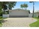 Exterior view of the house with a paved driveway and fenced yard at 1164 Bayview Ln, Port Orange, FL 32127