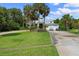 Two-story house with attached two-car garage, circular driveway, and lush landscaping at 200 John Anderson Dr, Ormond Beach, FL 32176