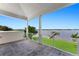 Covered patio showcasing picturesque waterfront and dock views at 200 John Anderson Dr, Ormond Beach, FL 32176