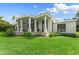 Back exterior of a luxury home with a large covered patio at 200 John Anderson Dr, Ormond Beach, FL 32176