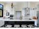 Bright kitchen boasts white cabinets, marble countertops, and a large island with seating at 200 John Anderson Dr, Ormond Beach, FL 32176