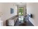 Bright living room with water view, fireplace, and stylish seating at 200 John Anderson Dr, Ormond Beach, FL 32176