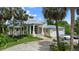 Two-story house with attached two-car garage, circular driveway, and lush landscaping at 200 John Anderson Dr, Ormond Beach, FL 32176
