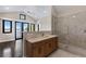 Large bathroom with marble vanity, walk-in shower, and water views at 200 John Anderson Dr, Ormond Beach, FL 32176