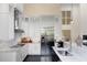 Modern kitchen with stainless steel appliances and white cabinetry at 200 John Anderson Dr, Ormond Beach, FL 32176