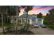 Luxury home with a two-car garage at sunset at 200 John Anderson Dr, Ormond Beach, FL 32176