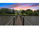 Wooden walkway leads to a beautiful waterfront property at 200 John Anderson Dr, Ormond Beach, FL 32176
