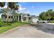 Two-story house with attached two-car garage, circular driveway, and lush landscaping at 200 John Anderson Dr, Ormond Beach, FL 32176