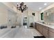 Luxurious bathroom with marble finishes and soaking tub at 200 John Anderson Dr, Ormond Beach, FL 32176