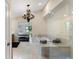 Elegant bathroom with marble floors and a chandelier at 200 John Anderson Dr, Ormond Beach, FL 32176