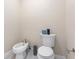Powder room with toilet, bidet, and marble floor at 200 John Anderson Dr, Ormond Beach, FL 32176