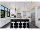 Spacious kitchen featuring a large island, white cabinetry, and high-end appliances at 200 John Anderson Dr, Ormond Beach, FL 32176