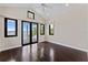 Spacious bedroom with dark hardwood floors and water views at 200 John Anderson Dr, Ormond Beach, FL 32176