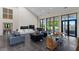 Open living space with a fireplace and floor to ceiling windows at 200 John Anderson Dr, Ormond Beach, FL 32176