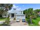 Luxury home with attached two-car garage and lush landscaping at 200 John Anderson Dr, Ormond Beach, FL 32176