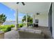 Relaxing covered patio with seating area and water views at 200 John Anderson Dr, Ormond Beach, FL 32176