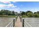Long wooden private dock extending to a waterfront home at 200 John Anderson Dr, Ormond Beach, FL 32176