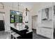Modern kitchen with white cabinets, marble countertops, and stainless steel appliances at 200 John Anderson Dr, Ormond Beach, FL 32176