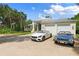 Luxury home with two-car garage and tropical landscaping at 200 John Anderson Dr, Ormond Beach, FL 32176