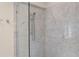 Shower with glass enclosure and marble tile at 200 John Anderson Dr, Ormond Beach, FL 32176