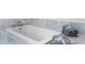 Relaxing bathtub with marble surround and gray towels at 200 John Anderson Dr, Ormond Beach, FL 32176