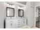 Double vanity bathroom with modern gray and white tile, and updated fixtures at 1117 Athlone Way, Ormond Beach, FL 32174