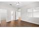Main bedroom with wood-look floors, en-suite bathroom, and ample closet space at 1117 Athlone Way, Ormond Beach, FL 32174