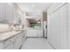 White kitchen with ample counter space and view to the backyard at 1117 Athlone Way, Ormond Beach, FL 32174