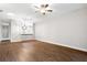 Spacious living room with wood-look floors and a ceiling fan at 1117 Athlone Way, Ormond Beach, FL 32174