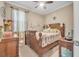 Cozy bedroom with a wooden bed frame and coastal decor at 450 W Delaware Ave, Lake Helen, FL 32744
