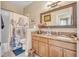 Bathroom with granite vanity, large mirror, and shower/tub at 450 W Delaware Ave, Lake Helen, FL 32744
