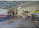 Two-car garage with ample storage and shelving at 450 W Delaware Ave, Lake Helen, FL 32744