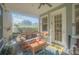Screened porch with comfy seating and outdoor ambiance at 450 W Delaware Ave, Lake Helen, FL 32744
