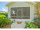 Spacious screened porch with access from the backyard at 450 W Delaware Ave, Lake Helen, FL 32744